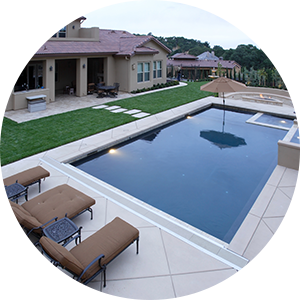 Outdoor pool behind a home