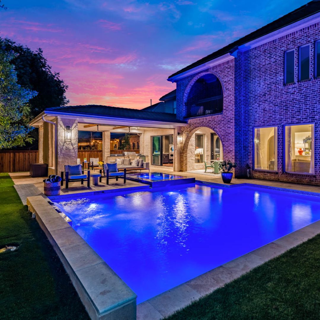 pool at night with interior lighting features