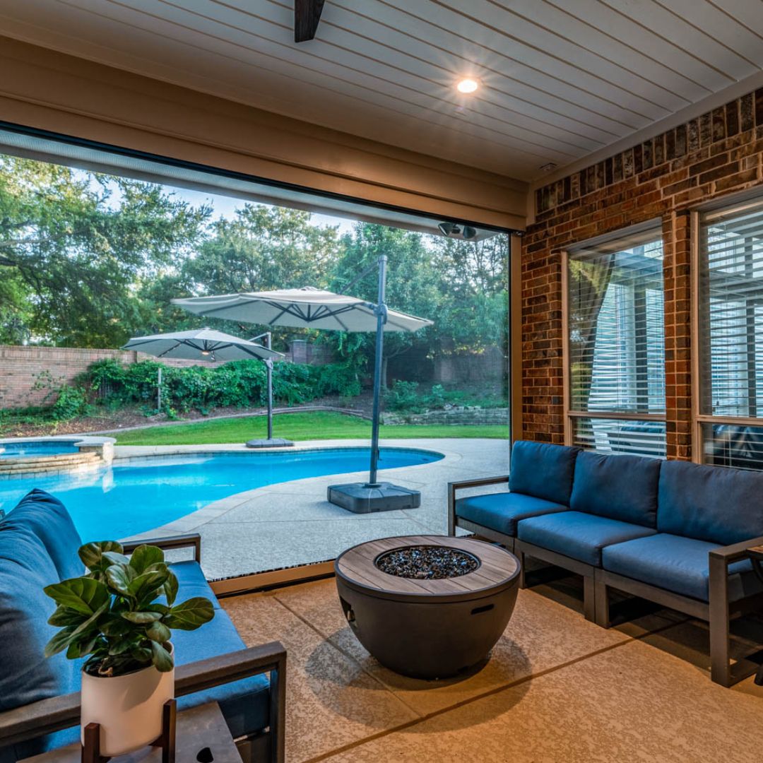 outdoor pool house that has a roll-down screen