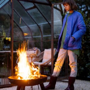 img of a woman by a fire