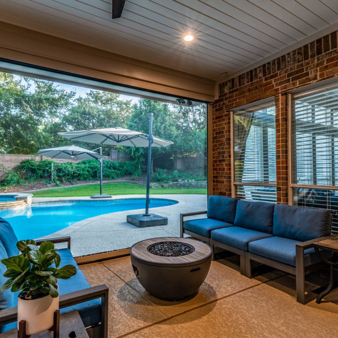A small fire pit under a covered patio