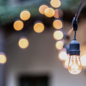 A string of patio lights illuminating an outdoor living space.