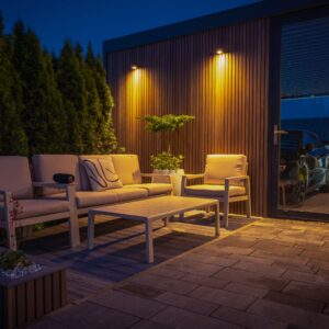 A patio area at night with soft glow ambient lights above