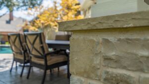patio column masonry, chairs and pool in background