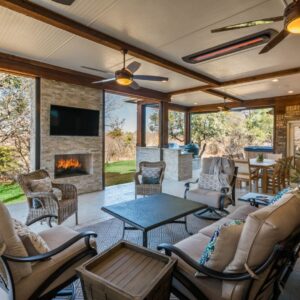 outdoor living space with a custom fireplace and seating area