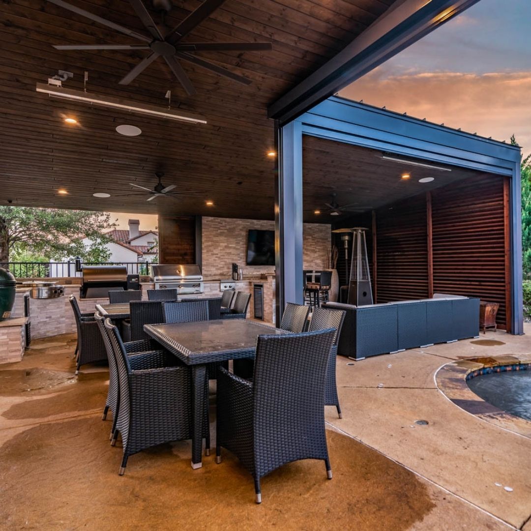 outdoor kitchen with seating areas and a good ambiance