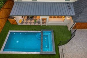 backyard renovation with pool and seating area